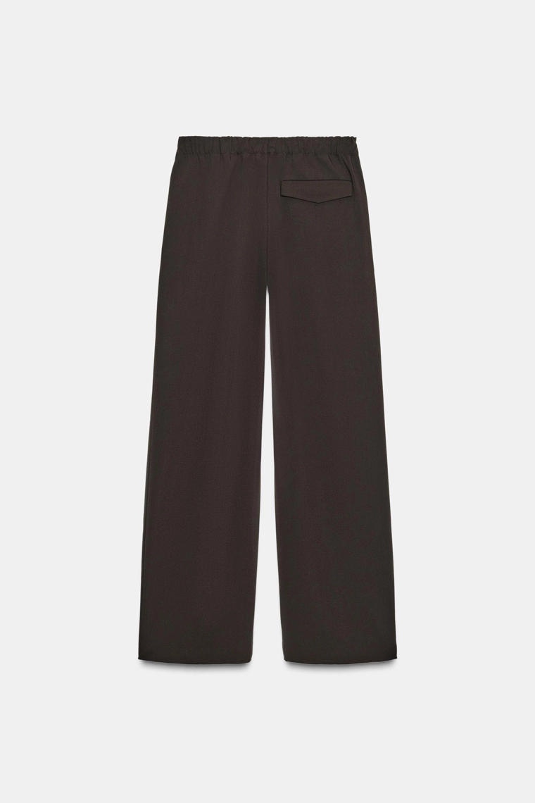 БРЮКИ С ЗАЩИПАМИ