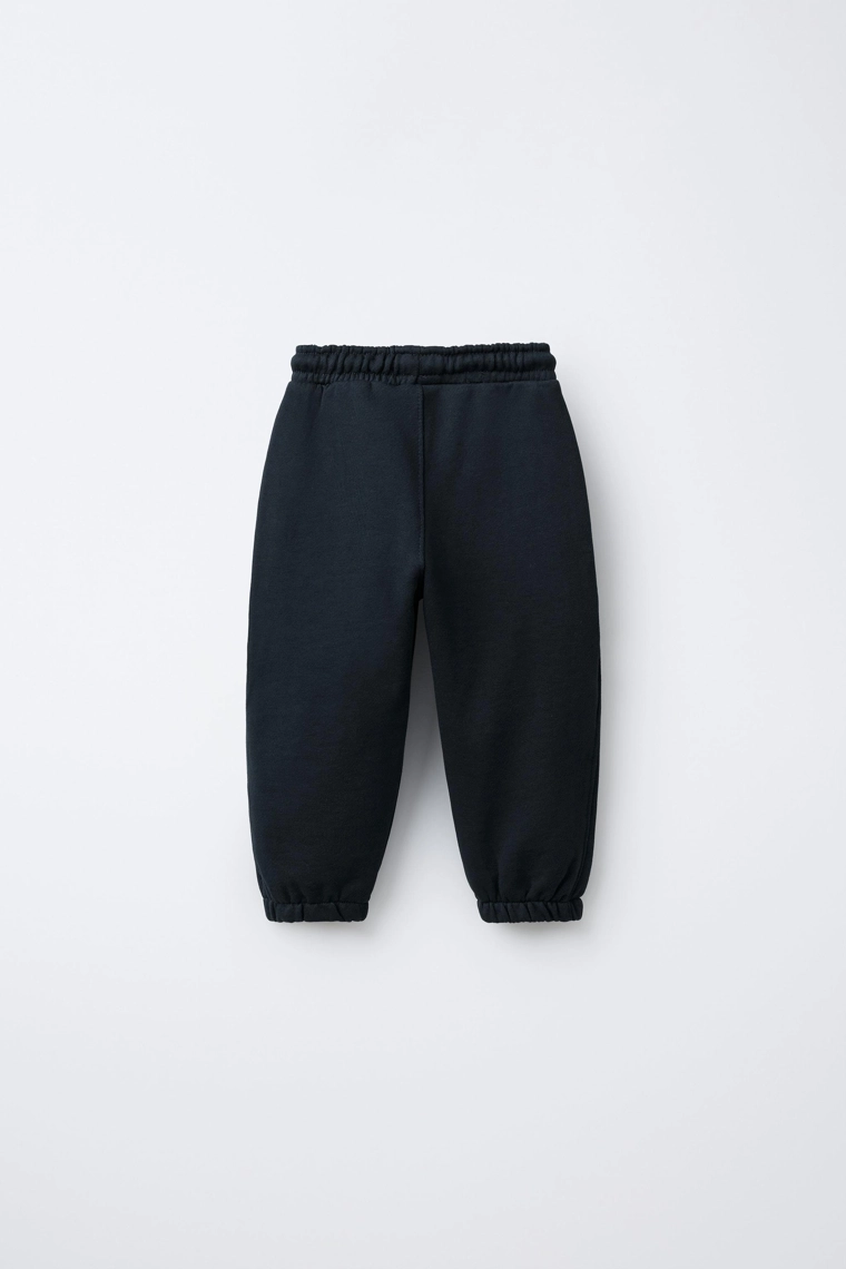 БРЮКИ-ДЖОГГЕРЫ С ЭТИКЕТКОЙ