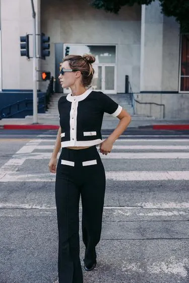 Брюки из букле с контрастной отделкой