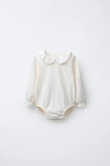 TEXTURED NECK BODYSUIT