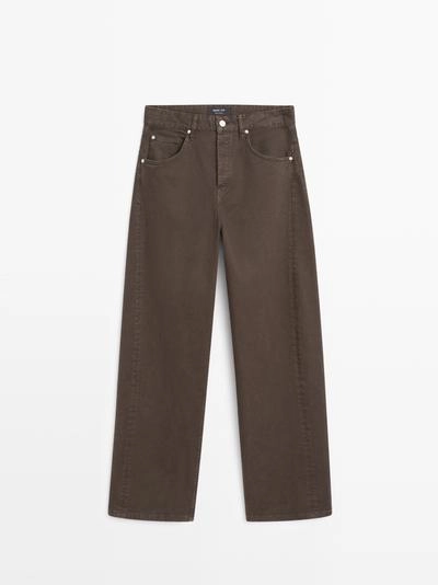 Джинсы с высокой талией и объемным кроем