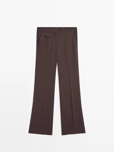 Брюки с карманами и расклешенным кроем- Заказать в России