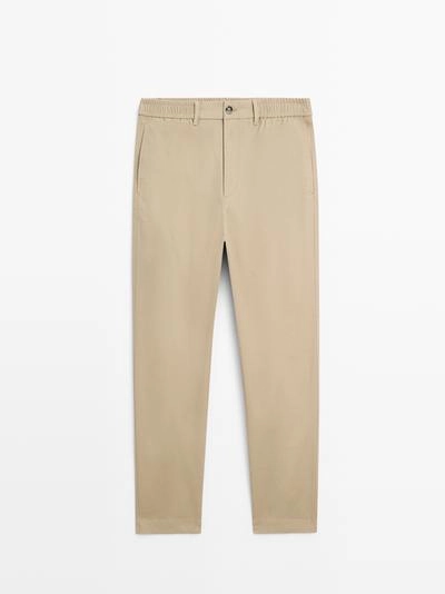 Хлопковые брюки с посадкой джоггер- Заказать в России