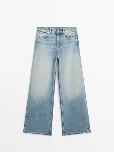 Джинсы с высокой посадкой и широкими брючинами