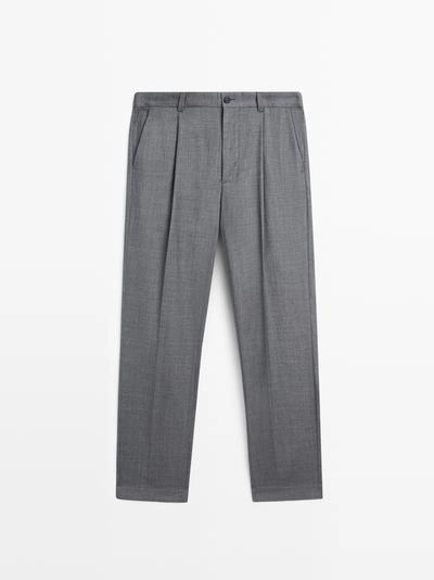 Брюки из шерсти свободного кроя с деталями вытачек