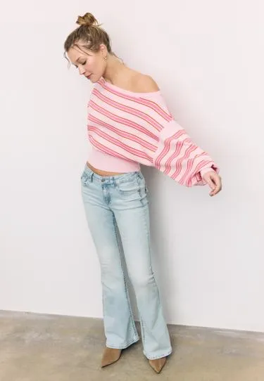 Трикотажный свитер асимметричного кроя в рубчик