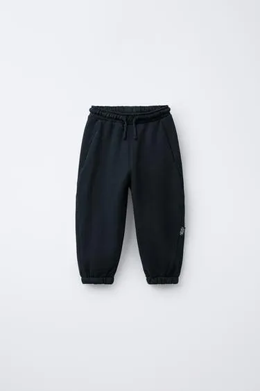 Брюки-джоггеры с этикеткой- Заказать в России