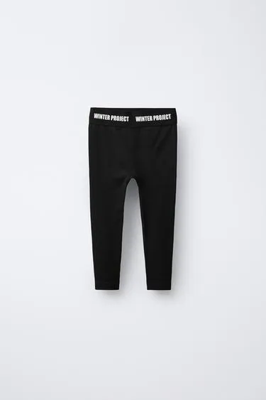 Термолегинсы в рубчик с рельефным текстом- Заказать в России