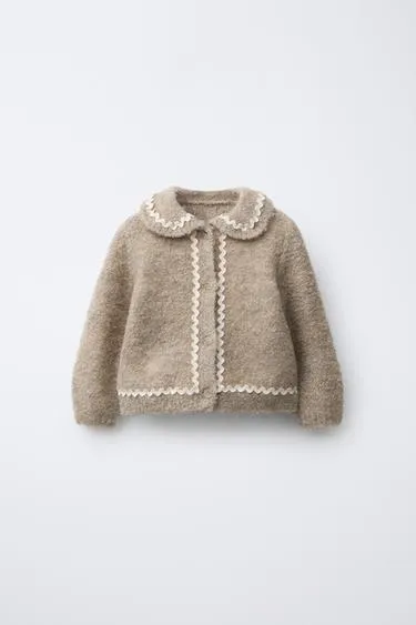 Вязаный кардиган с воланом- Заказать в России