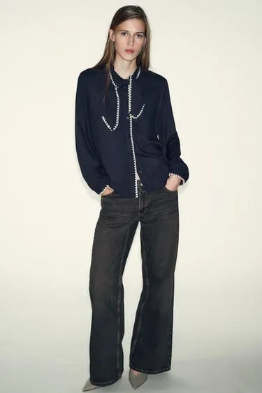 Блуза с бантом и контрастной отстрочкой