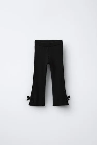 Расклешенные трикотажные легинсы с бантиками- Заказать в России