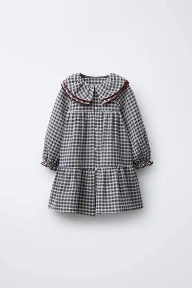 Платье в клетку с волнистой оторочкой