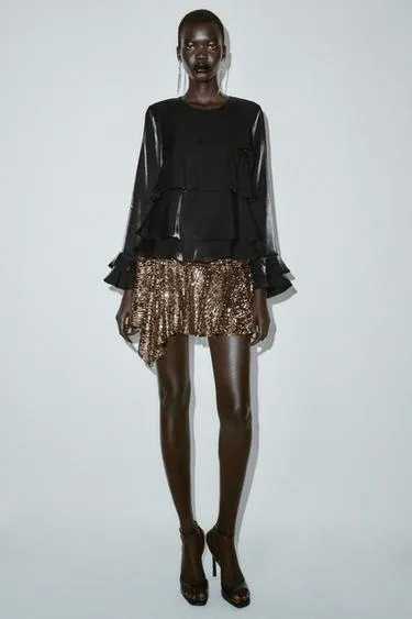 Блуза из блестящей ткани с воланами- Заказать в России