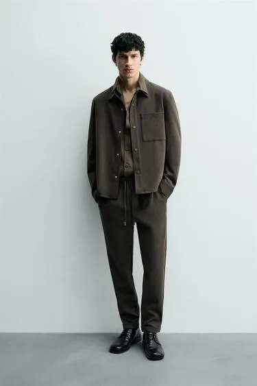 Комфортабельные брюки с манжетами на поясе без утюжки