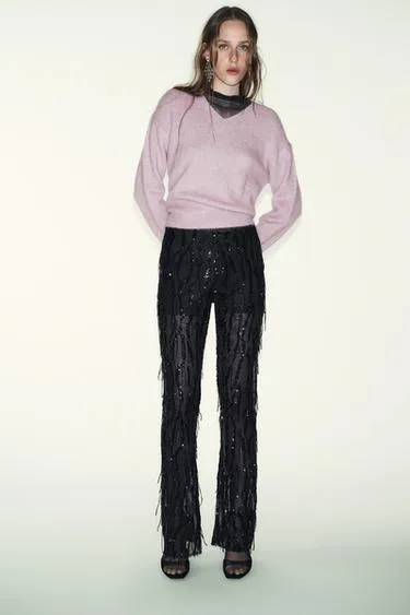 Расклешенные легинсы с пайетками