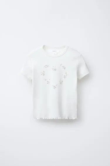 Футболка в рубчик с цветами и бусинами- Заказать в России