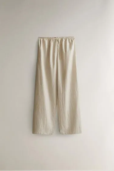 Брюки с атласным блеском- Заказать в России