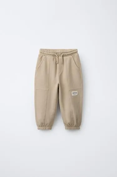 Брюки-джоггеры с этикеткой- Заказать в России