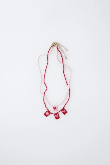 Набор из двух ожерелий с бусинами и сердечками- Заказать в России