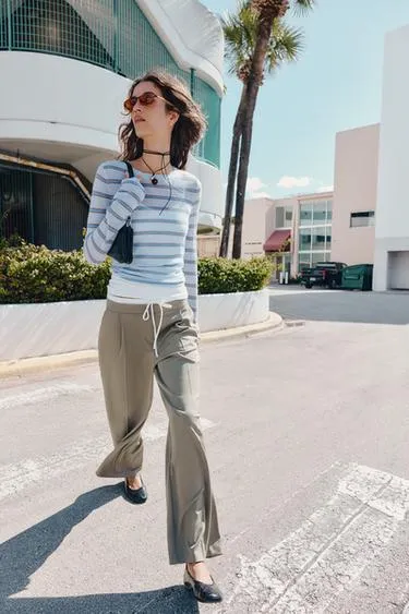 Брюки с широкими штанинами и двойным поясом- Заказать в России