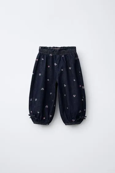 Джинсы бомбачо с вышитыми цветами