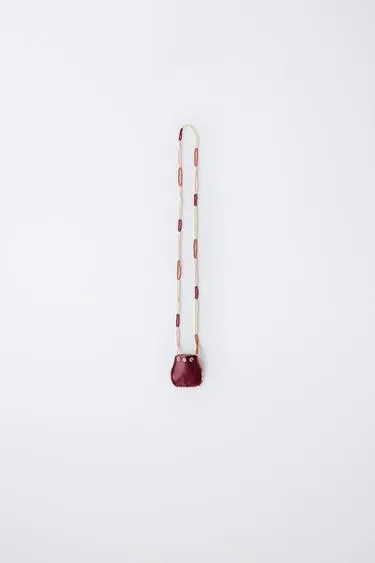 Ожерелье с бусинами и сумочкой- Заказать в России