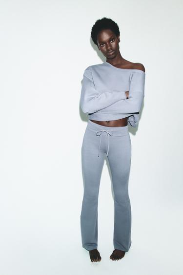 Zara Расклешенные брюки с эффектом потертости купить с доставкой.