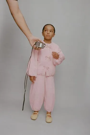 Куртка с текстурой и бантами