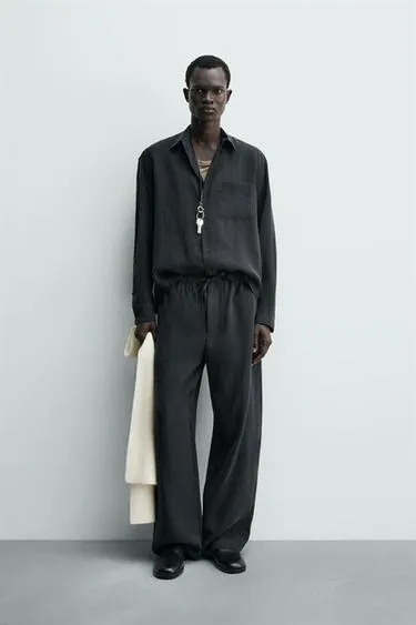 Потрепанные брюки свободного кроя- Заказать в России