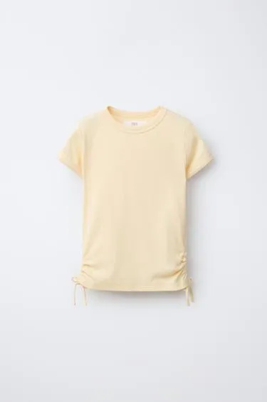 Футболка из модала с вырезами и бантами