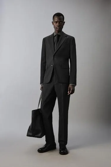 Костюмные брюки в клетку из рельефной ткани