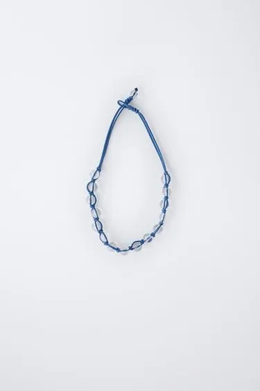 Колье на шнурке с бусинами