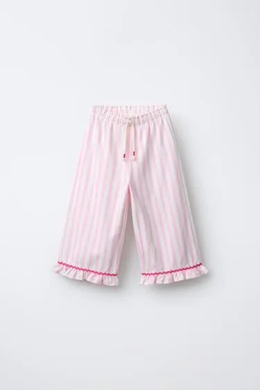 Брюки в полоску с воланами