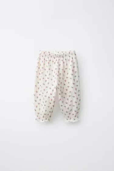 Брюки с цветочным принтом и текстурой- Заказать в России