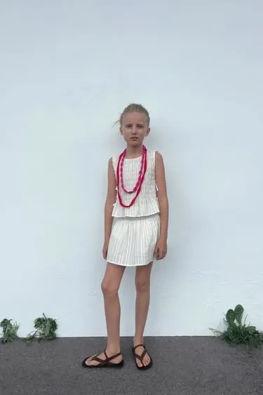 Топ с эластичной деталью и бантами- Заказать в России