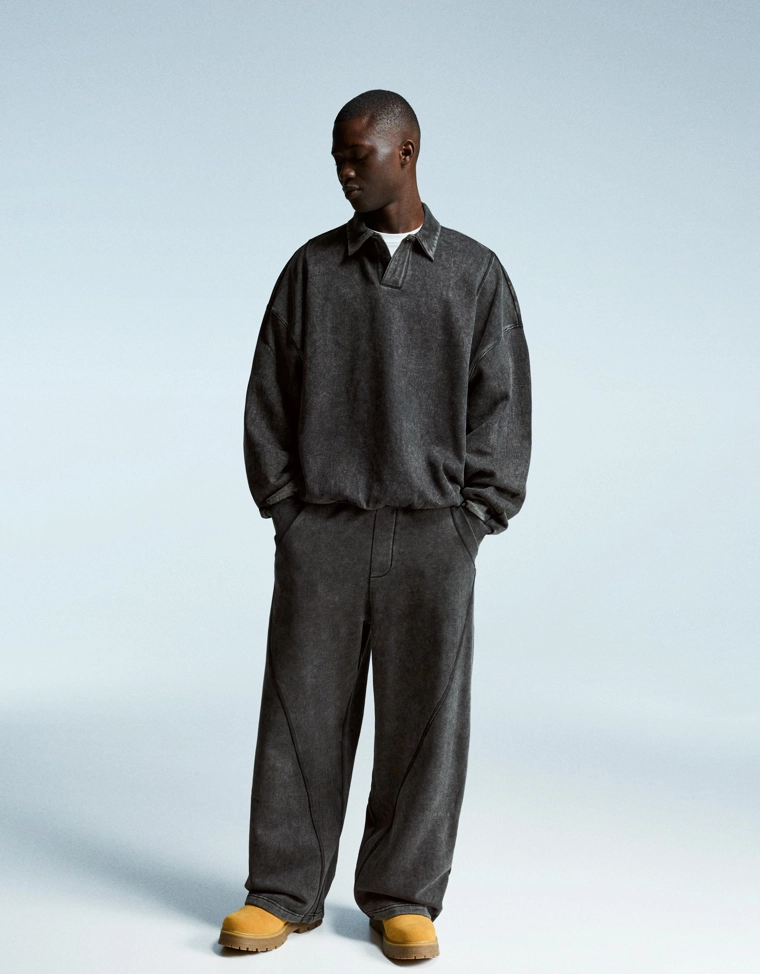 Объемные брюки свободного кроя с эффектом потертости