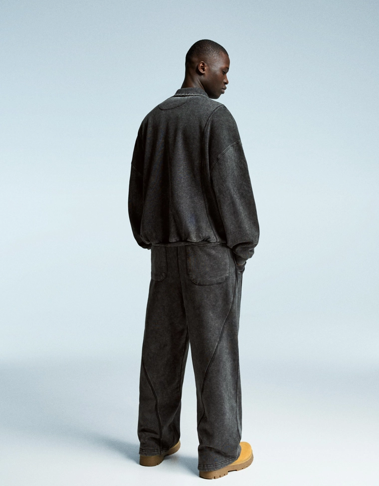 Объемные брюки свободного кроя с эффектом потертости