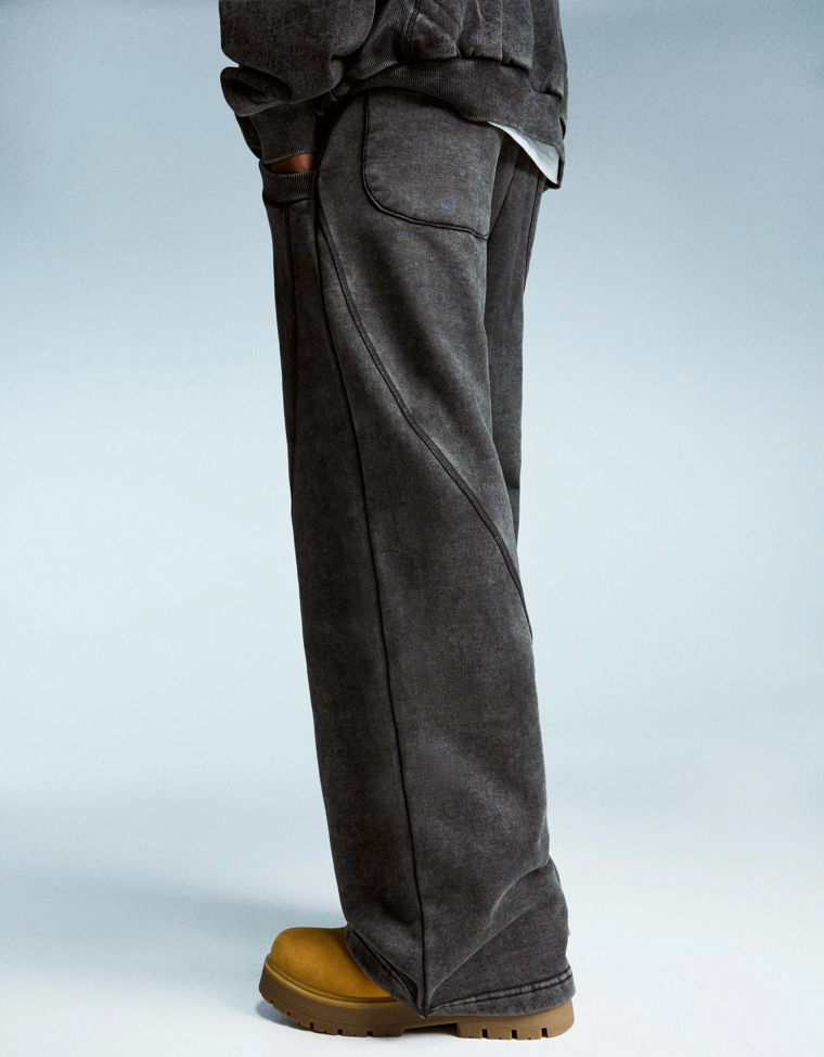 Объемные брюки свободного кроя с эффектом потертости