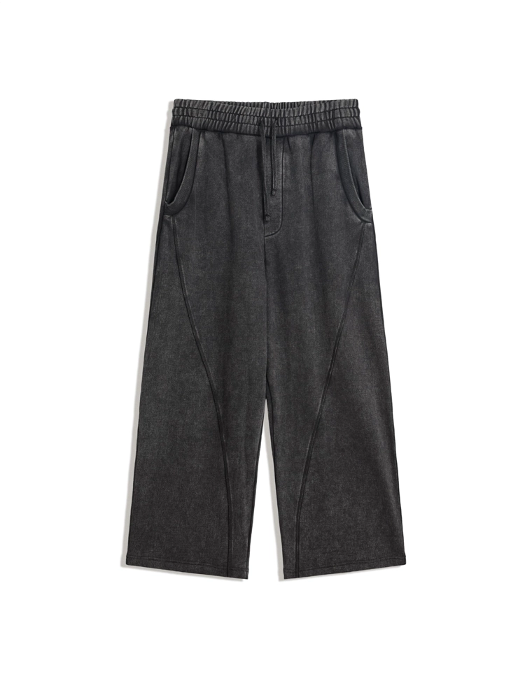 Объемные брюки свободного кроя с эффектом потертости