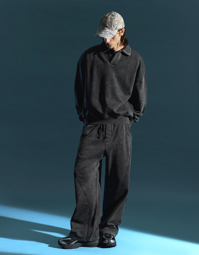 Объемные брюки свободного кроя с эффектом потертости