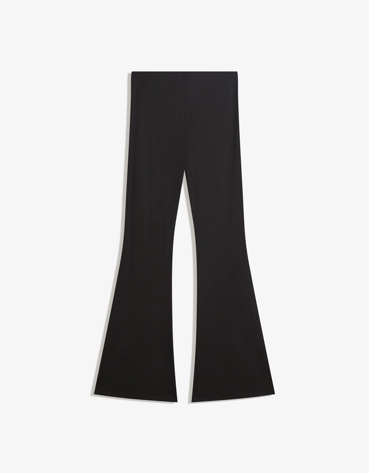 Расклешенные брюки с люверсами на поясе