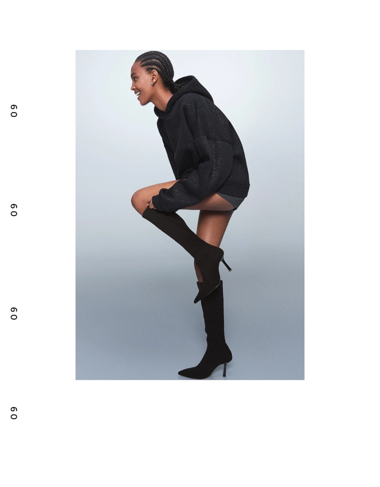 Эластичные сапоги на каблуке