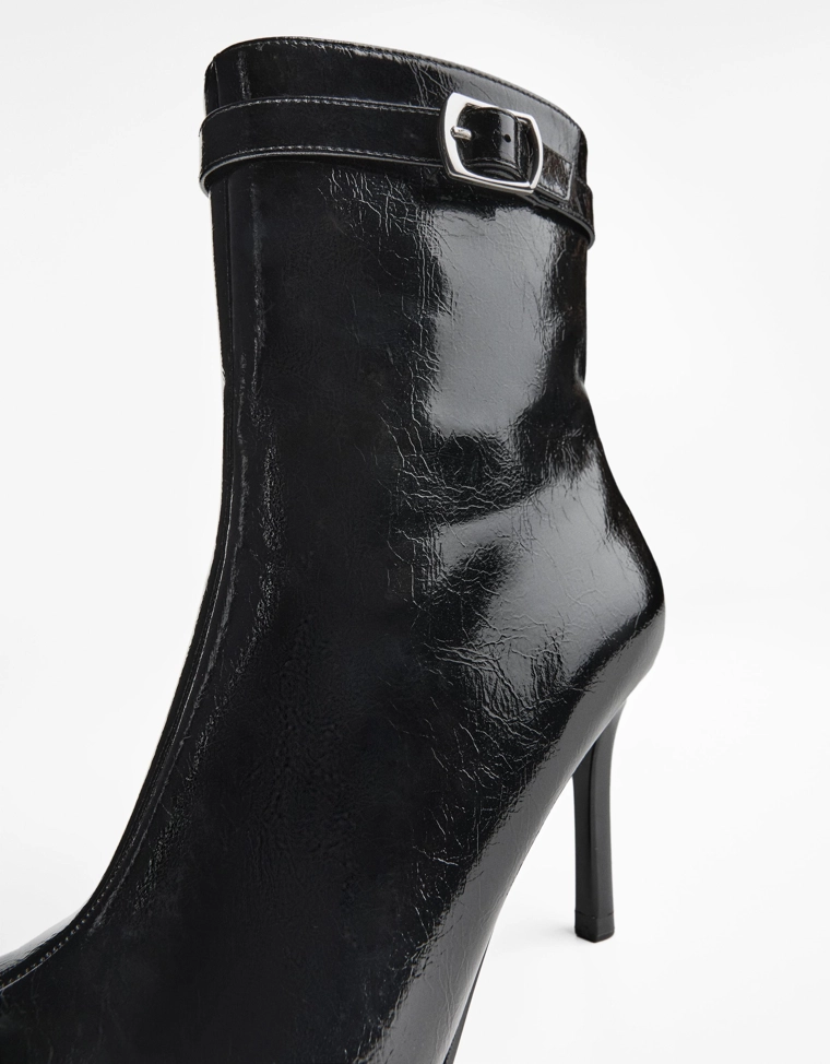 Heeled ankle boots with buckle strap