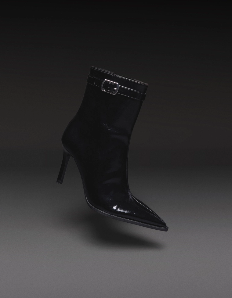 Heeled ankle boots with buckle strap