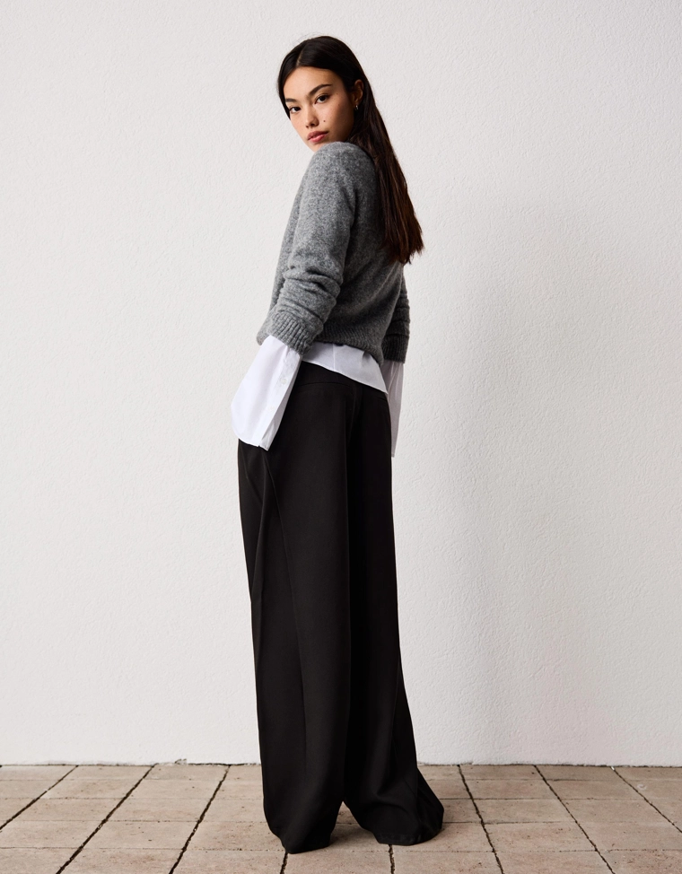 Черный пуховик с объемным ворсом