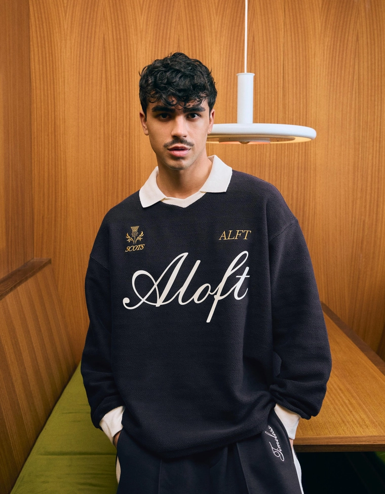 Поло геометрического кроя с длинными рукавами и принтом