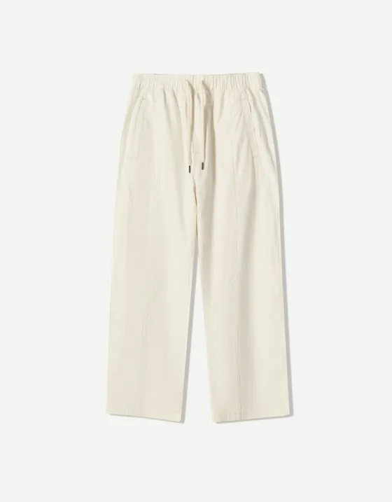 Брюки объемного свободного кроя в полоску