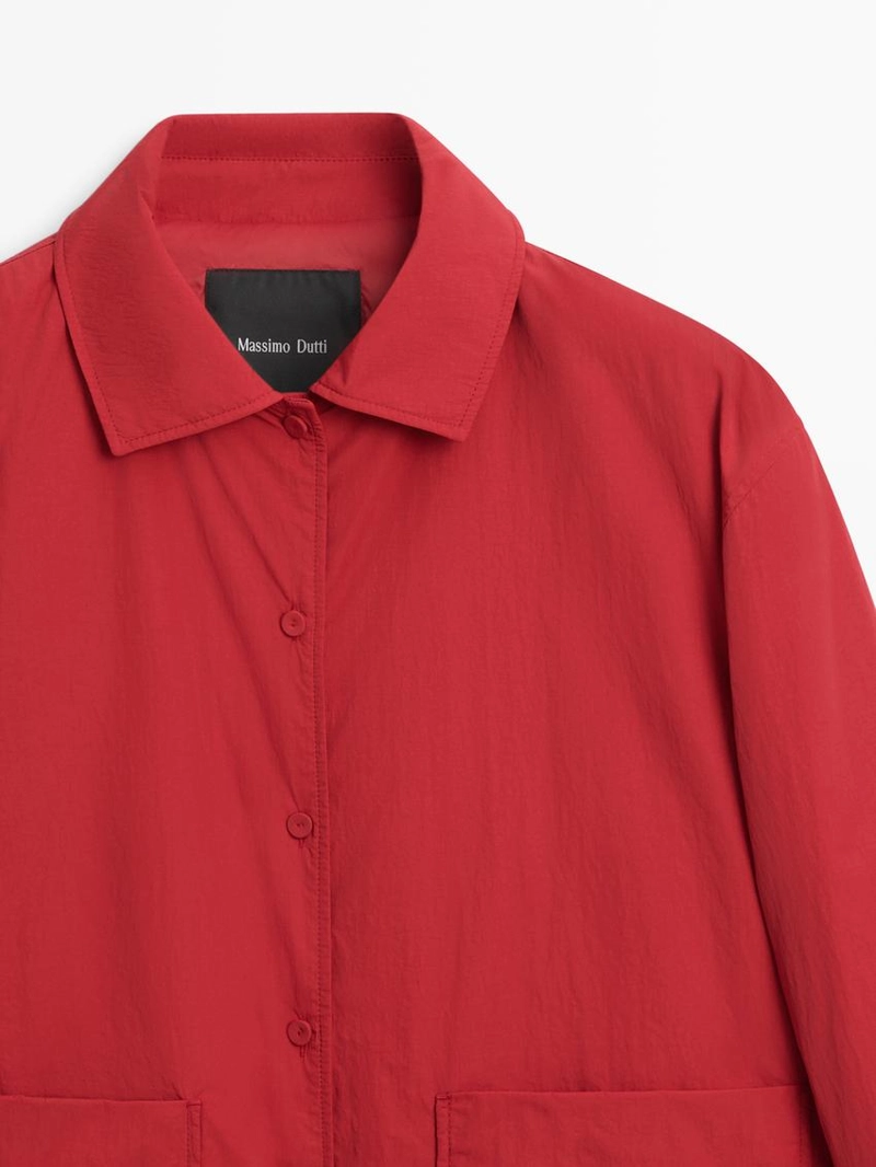 Короткая пуховая куртка с карманом