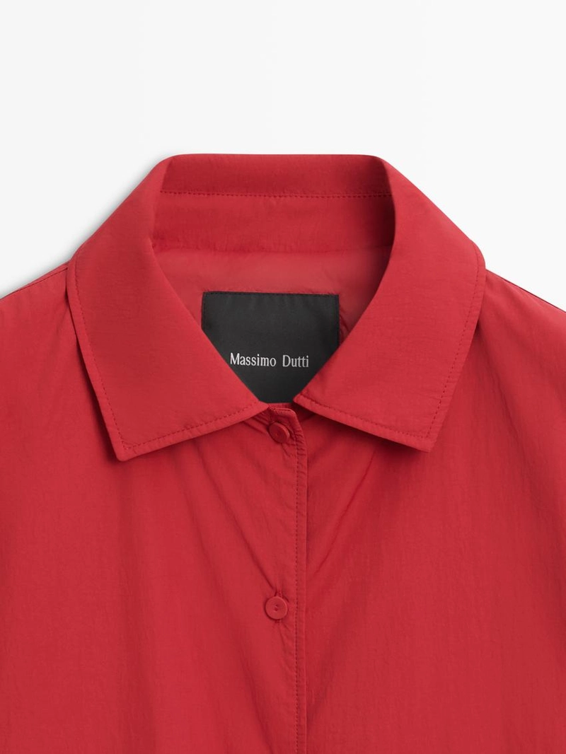 Короткая пуховая куртка с карманом