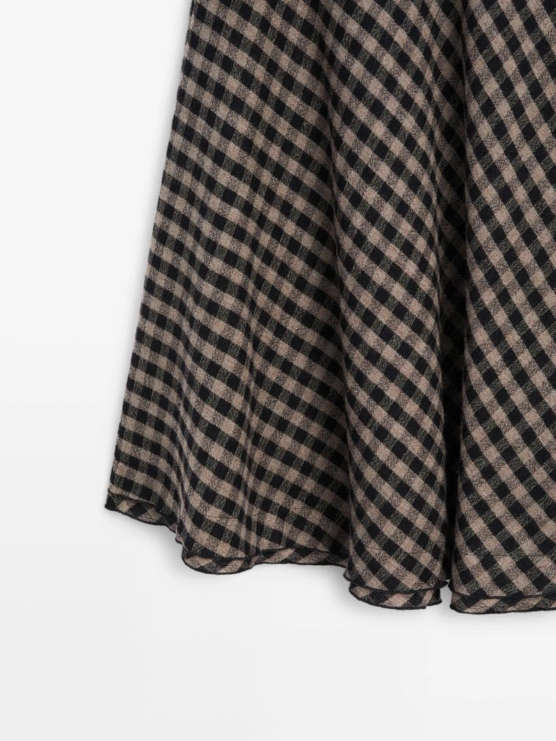 Расклешенная юбка с клетчатым узором